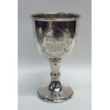 An Edwardian silver goblet with wreath decoration