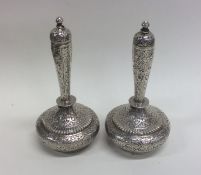 A pair of Indian baluster shaped silver vases engr