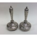 A pair of Indian baluster shaped silver vases engr