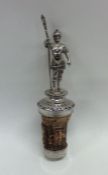 A silver bottle stopper in the form of a soldier o