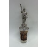 A silver bottle stopper in the form of a soldier o