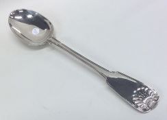 A fiddle, thread and shell silver basting spoon. L