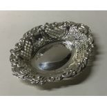 An Edwardian embossed silver bonbon dish. Birmingh