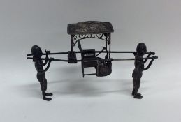 A Chinese model of a rickshaw. Approx. 29 grams. E