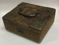 A leatherette jewellery box with brass mounts. Est