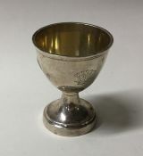 A Georgian silver egg cup on spreading foot. Appro