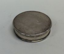 A circular Georgian silver counter box with lift-o