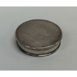 A circular Georgian silver counter box with lift-o