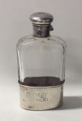 An Edwardian silver and glass flask. London. Est.