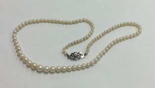 A graduated string of pearl beads with silver clas