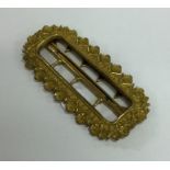 An Antique gilt metal buckle with floral decoratio