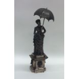 A Continental figure of a lady with parasol in Vic