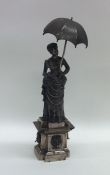 A Continental figure of a lady with parasol in Vic