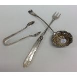 A silver ladle together with a pickle fork, and su