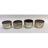 A set of four Victorian silver engraved salts. Lon