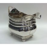 A good quality Georgian silver cream jug on ball f