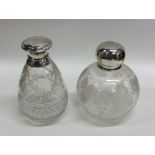 Two etched glass and silver mounted scent bottles.