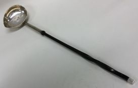 A good quality large Georgian silver toddy ladle w