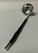 A Victorian silver toddy ladle with whalebone hand