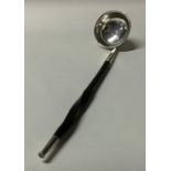 A Victorian silver toddy ladle with whalebone hand