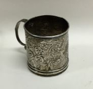 A small Victorian silver embossed christening cup.