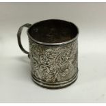 A small Victorian silver embossed christening cup.