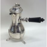 An unusual early silver coffee pot with side handl