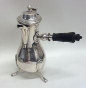 An unusual early silver coffee pot with side handl