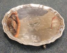 A good George III circular salver with crested cen
