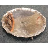 A good George III circular salver with crested cen
