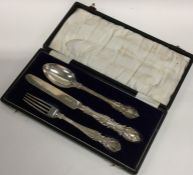 A good cased silver three piece christening set. L