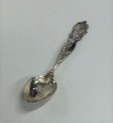 A stylish Sterling silver spoon decorated with scr