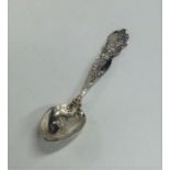 A stylish Sterling silver spoon decorated with scr