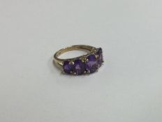 A large amethyst five stone ring in 9 carat claw m