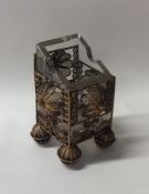 A silver gilt filigree vase with glass liner. Appr