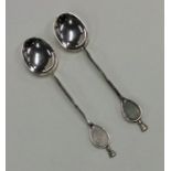 A pair of Edwardian silver coffee spoons in the fo