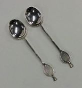 A pair of Edwardian silver coffee spoons in the fo