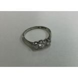 An 18 carat three stone diamond ring. Approx. 0.45