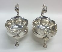 A good pair of Georgian silver sauce boats with sc