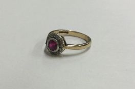 An Antique diamond and ruby ring of circular form