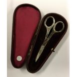 A cased pair of silver handled scissors. Approx. 3