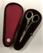 A cased pair of silver handled scissors. Approx. 3