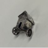 An unusual miniature silver cart decorated with fi