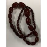 A good string of graduated red amber beads. Approx