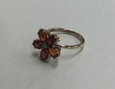A diamond and citrine daisy head cluster ring in 9