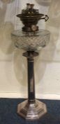 A tall Edwardian silver oil lamp on hexagonal base