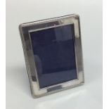 A small modern rectangular silver picture frame. A