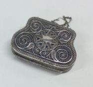 A Russian silver filigree purse with fitted interi