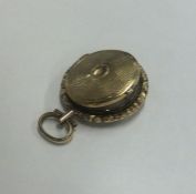 A Georgian gilt metal 'In Memory Of' locket. Appro
