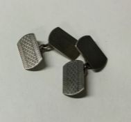 A pair of engine turned silver cufflinks. Approx.